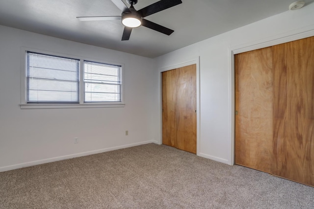 unfurnished bedroom with light carpet and ceiling fan