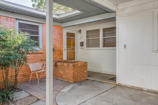 property entrance with a patio