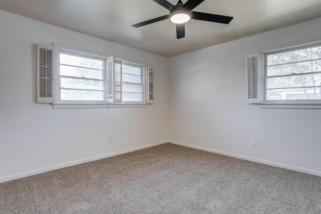 carpeted empty room featuring ceiling fan