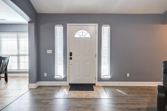 entryway with hardwood / wood-style flooring