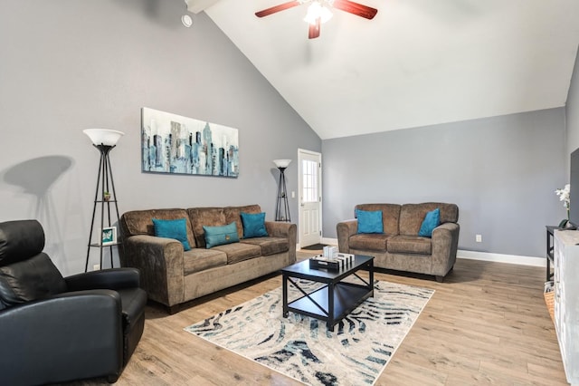 living room featuring light hardwood / wood-style flooring, high vaulted ceiling, beamed ceiling, and ceiling fan