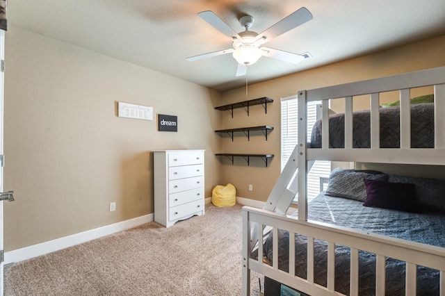 bedroom featuring ceiling fan and light carpet