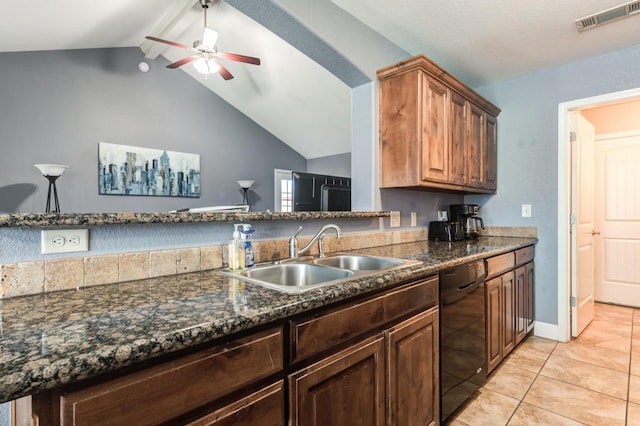 kitchen featuring lofted ceiling, sink, dark stone countertops, black dishwasher, and ceiling fan