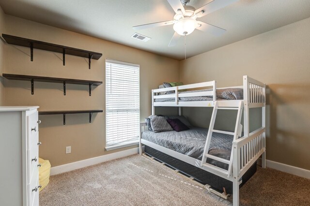 bedroom with light carpet and ceiling fan