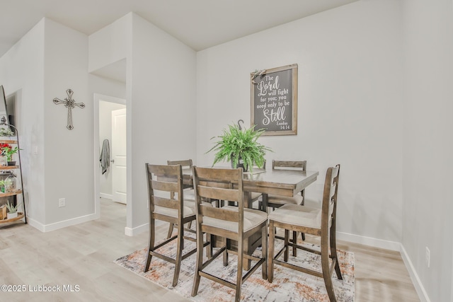 2927 Abbeville Ave, Wolfforth, TX 79382 - dining room featuring light wood-style floors and baseboards