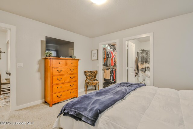2927 Abbeville Ave, Wolfforth, TX 79382 - bedroom featuring baseboards, light carpet, a walk in closet, and a closet