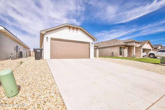 2927 Abbeville Ave, Wolfforth, TX 79382 - ranch-style home featuring central AC, brick siding, and concrete driveway