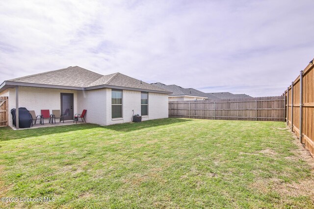 2927 Abbeville Ave, Wolfforth, TX 79382 - back of house featuring a patio area, brick siding, and roof with shingles