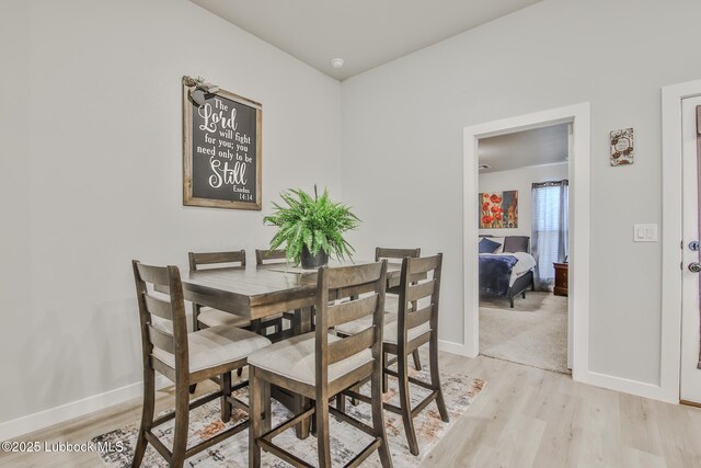 2927 Abbeville Ave, Wolfforth, TX 79382 - dining room with light wood finished floors and baseboards