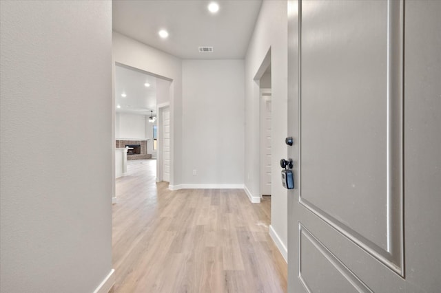 hallway featuring light hardwood / wood-style flooring