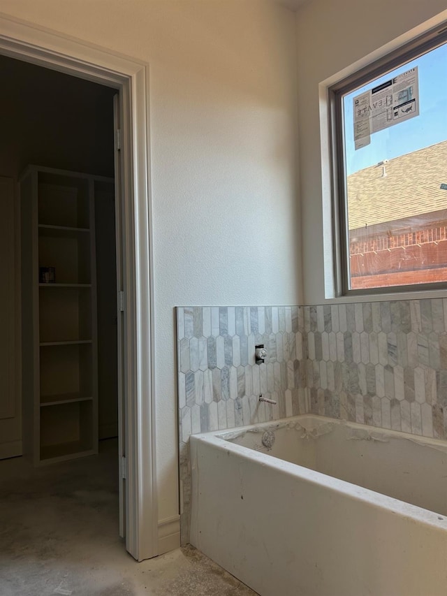 bathroom featuring a washtub