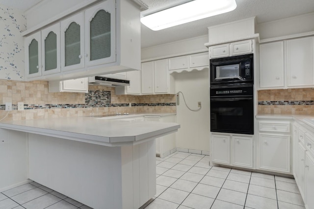 kitchen featuring light tile patterned flooring, white cabinetry, kitchen peninsula, decorative backsplash, and black appliances