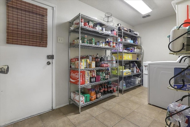 pantry featuring washer / clothes dryer