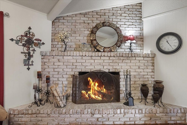 room details with crown molding, a brick fireplace, beam ceiling, and a textured ceiling