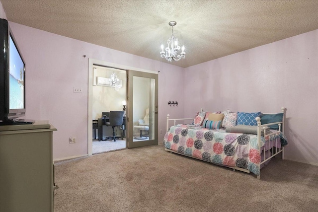 bedroom with carpet floors, a textured ceiling, and an inviting chandelier