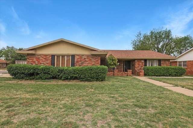 ranch-style house with a front lawn