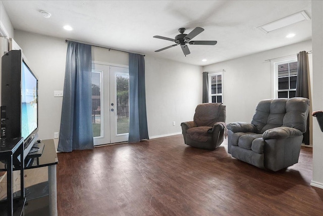 sitting room with ceiling fan, dark hardwood / wood-style flooring, and french doors