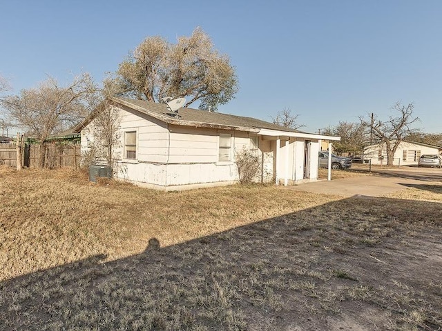 back of property featuring a yard