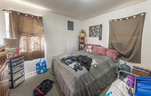 carpeted bedroom featuring electric panel and a textured ceiling