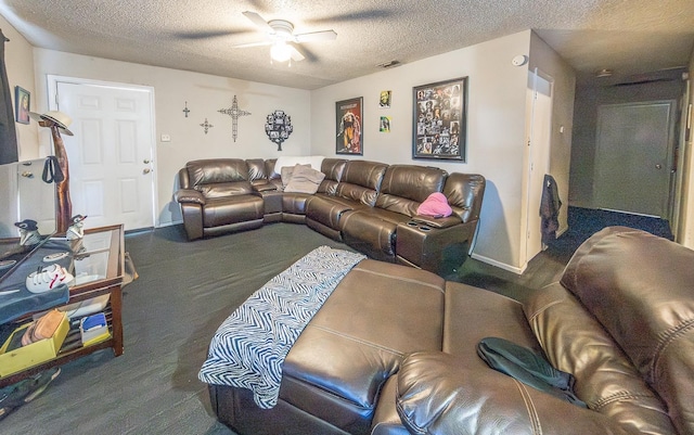 living room with ceiling fan, carpet floors, and a textured ceiling