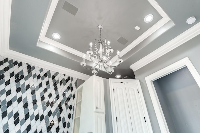 10704 Orlando Ave, Lubbock, TX 79423 - interior details featuring crown molding, visible vents, a raised ceiling, a chandelier, and recessed lighting