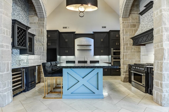 10704 Orlando Ave, Lubbock, TX 79423 - kitchen featuring backsplash, dark cabinets, stainless steel appliances, and wine cooler