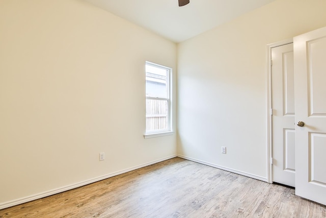 spare room with ceiling fan and light hardwood / wood-style flooring