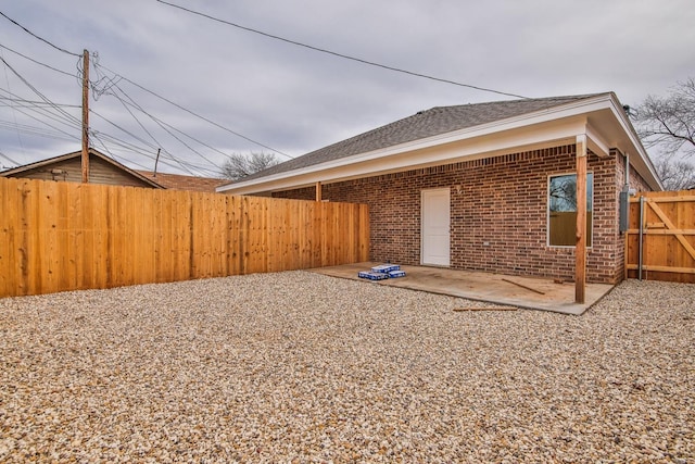 rear view of property featuring a patio