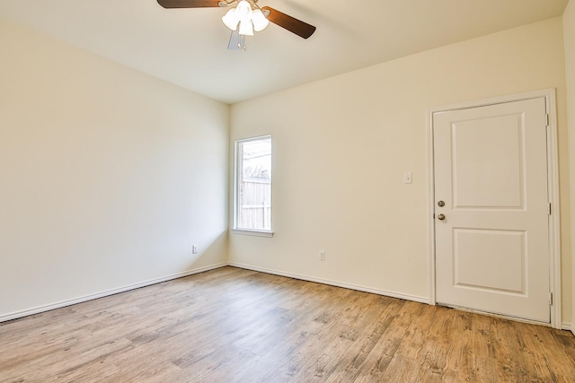 empty room featuring ceiling fan and light wood-type flooring