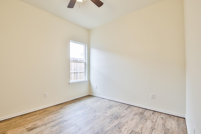 spare room featuring light hardwood / wood-style flooring and ceiling fan