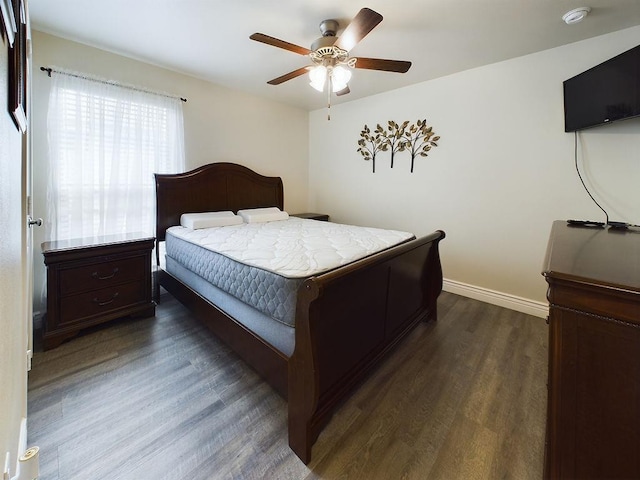 bedroom featuring dark wood-type flooring and ceiling fan