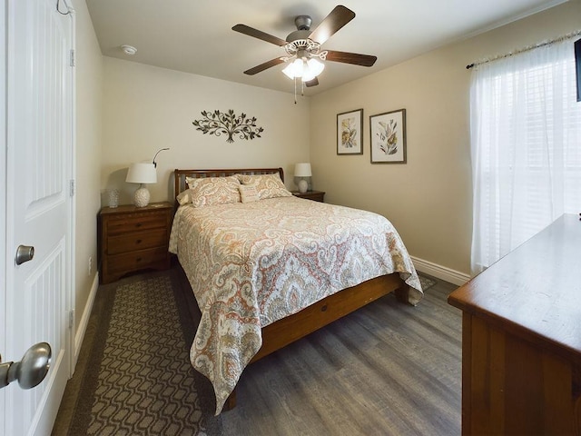 bedroom featuring dark hardwood / wood-style flooring and ceiling fan