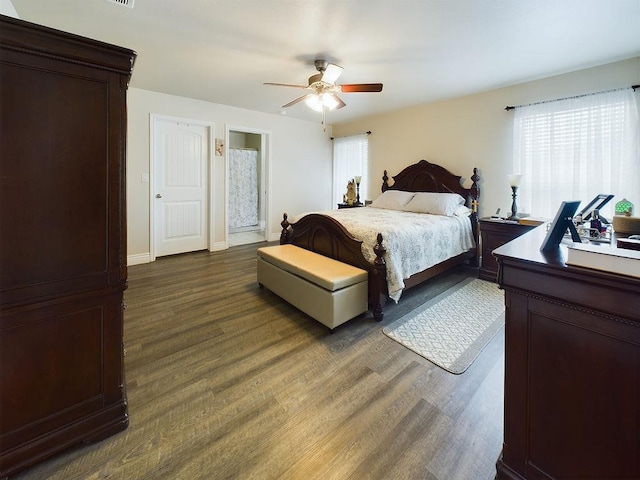 bedroom with dark wood-type flooring and ceiling fan