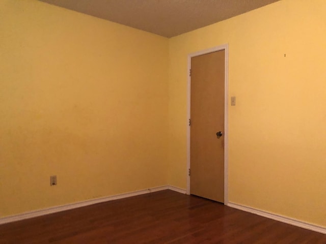 empty room featuring hardwood / wood-style flooring