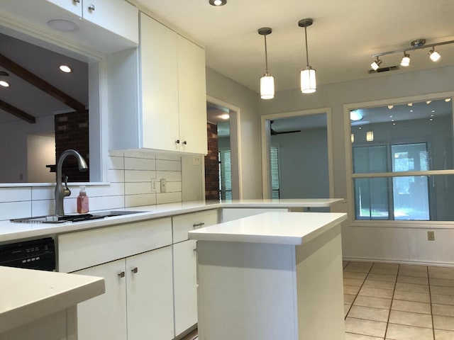 kitchen with light tile patterned flooring, sink, white cabinetry, dishwasher, and backsplash