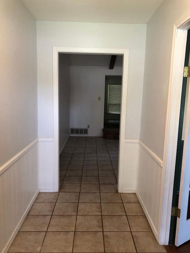 corridor with light tile patterned floors