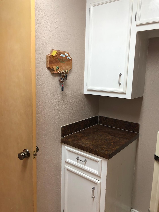 interior space featuring white cabinets