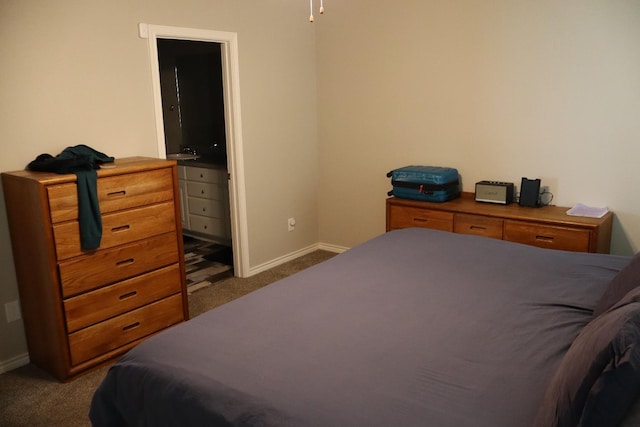 bedroom featuring dark colored carpet