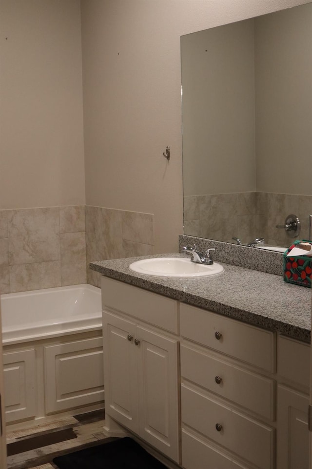 bathroom featuring vanity and a bathtub