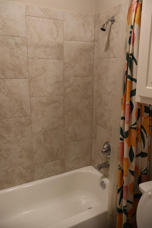 bathroom with shower / bath combo