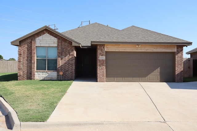 ranch-style house with a garage and a front yard