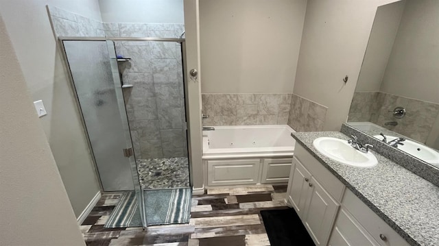 bathroom featuring vanity, hardwood / wood-style floors, and separate shower and tub