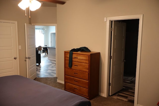 bedroom with dark colored carpet