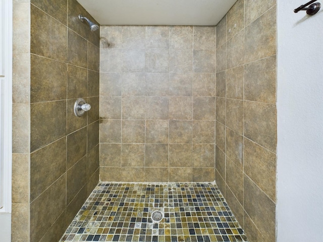 bathroom with a tile shower