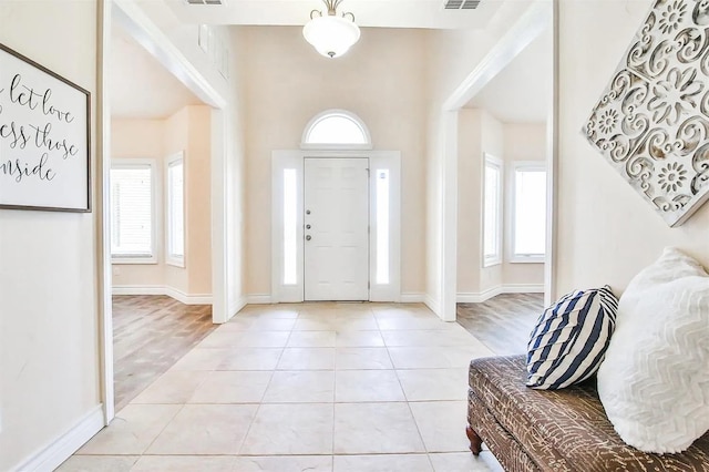 foyer entrance featuring light tile patterned flooring