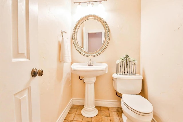 bathroom featuring tile patterned floors and toilet