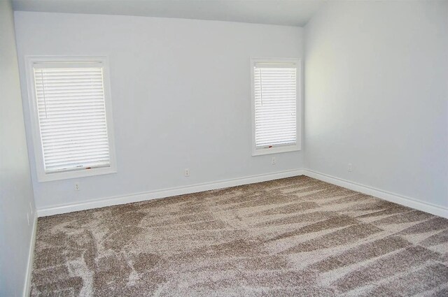 unfurnished room featuring carpet