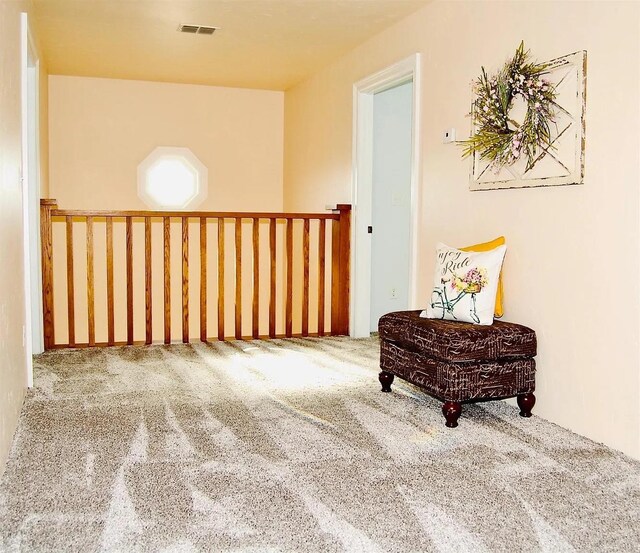 hallway featuring carpet