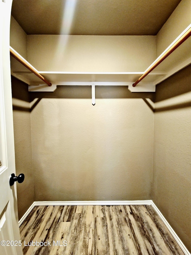 2834 E 7th St, Lubbock, TX 79403 - walk in closet with wood finished floors