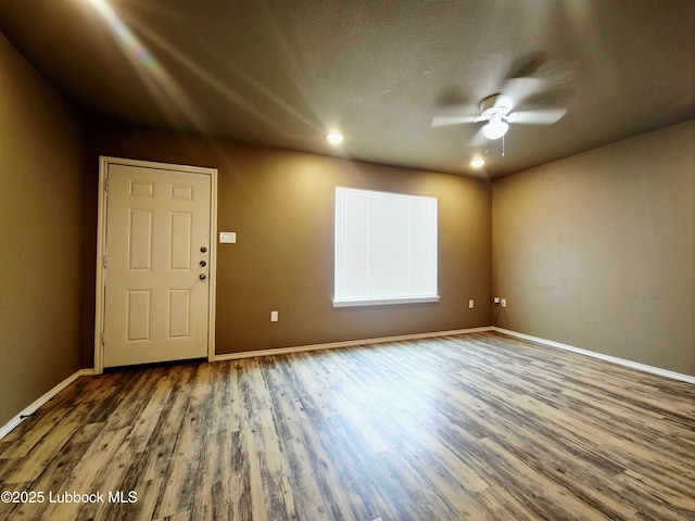 2834 E 7th St, Lubbock, TX 79403 - unfurnished room featuring wood finished floors, ceiling fan, baseboards, and recessed lighting